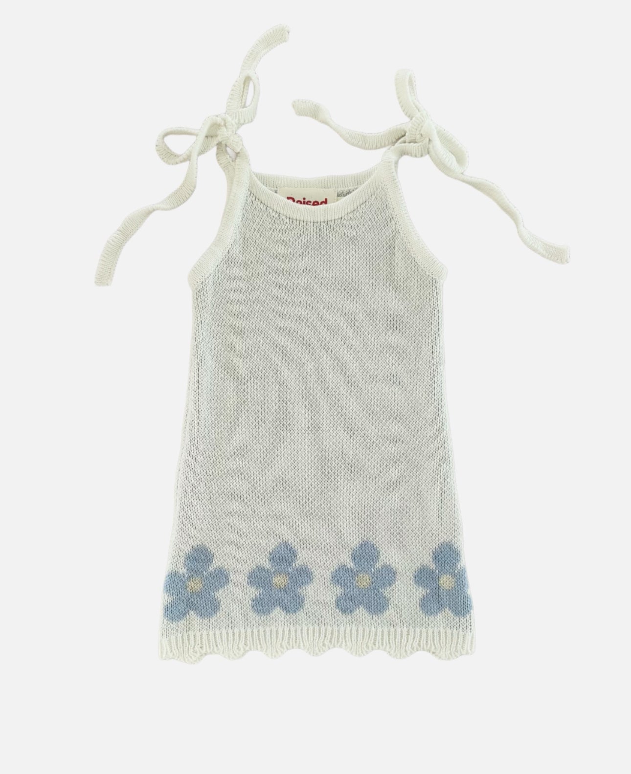 Flat lay of blossom knit dress on white background