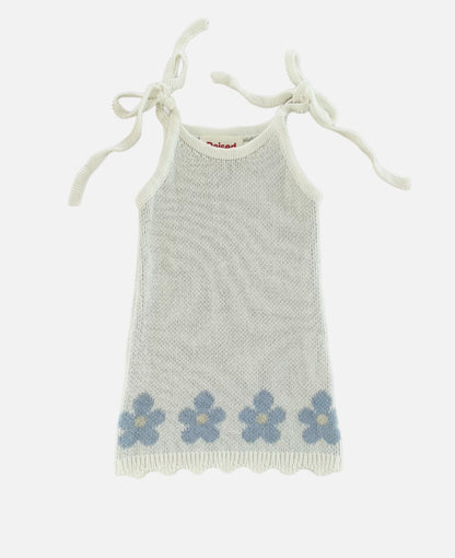 Flat lay of blossom knit dress on white background